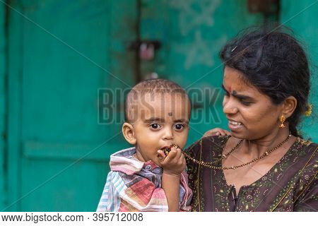 Chikkanayakanahalli, Karnataka, India - November 3, 2013: Closeup Portrait Of Proud Young Mother Wit