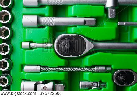 Mechanics Tool Set And Mechanic's Tool Box Close-up. Plastic Green Storage Box Case. Mechanics Tool