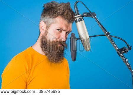 Man Recording In Studio. Bearded Man Sing In Microphone. Karaoke. Man Singing With A Microphone. Sin