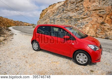 Ios, Greece - September 20, 2020: Red Seat Mii On The Road In The Mountainous Part Of Ios Island. Cy