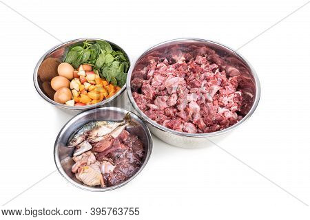 Ingredients Of Barf Raw Food Recipe For Dogs Consisting Meat, Organs, Fish, Eggs And Vegetable