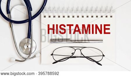 Stethoscope,glasses And Pen With Notepad With Text A Histamine On White Background
