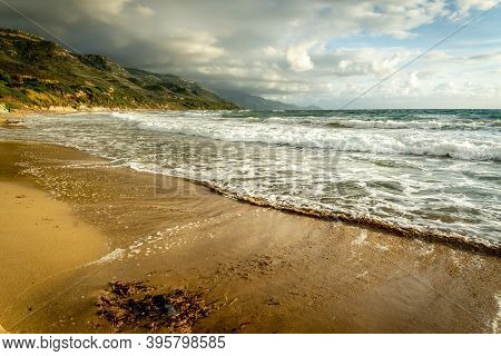 Clouds Over La Speranza Sandy Shore At Sunset. Sardinia, Italy