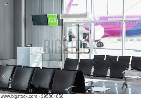 Black Seats In Departure Lounge In Modern Airport, Stock Image