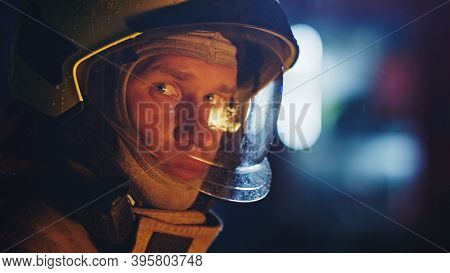 Portrait Shot Of A Fireman In Action In Full Uniform. Firefigters Training, Fire Drill. High Quality