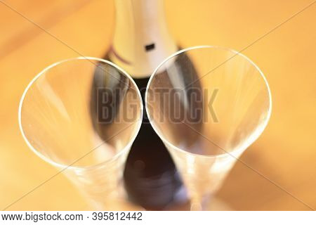 Bottle Of Shampagne And A Pair Empty Glasses Before Drinking