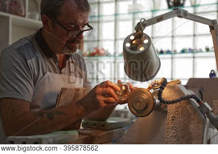 A Craftsman Working In The Sculpting Department At The Waterford Crystal Factory, In The City Of Wat