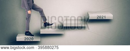 Young Asian Business Man In Face Mask Walk On Staircase To New Year 2021 While Crisis Of Pandemic Co