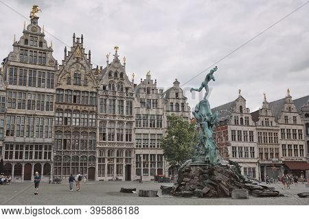 Brabo Fountain And Traditional Flemish Architecture At Grote Markt Square In Antwerp In Belgium.