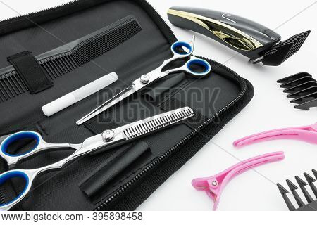 Hair Scissors Set Hairdressing Tools With Cordless Electric Hair Clipper Are Isolated On White Backg