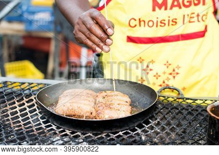 Abidjan, Ivory Coast From September 11 2016: Barbecue Festival Of Abidjan. A Cook In A Grill Held Th