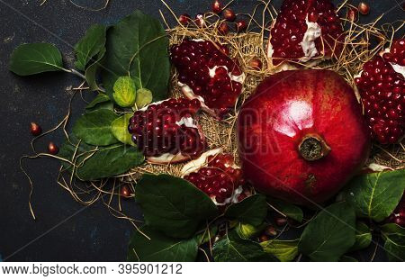 Red Pomegranate In The Starw, Rustic Style, Black Background, Top View