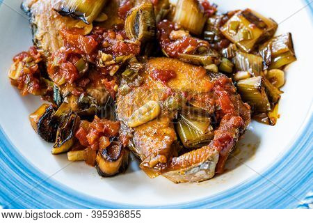 Bonito Fish Pieces With Tomato Sauce And Leek In Plate Baked In Oven / Fish Casserole.
