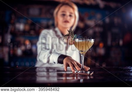 Girl Barman Concocts A Cocktail On The Saloon