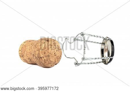 Separated Champagne Cork And Muselet Isolated On White Background.
