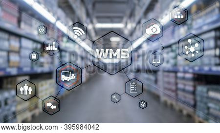 Inscription Wms On Blurred Warehouse Background. Werehouse Management System.