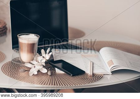 Notepad, Laptop And Coffee Cup On Wood Table. View From Above