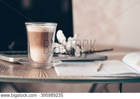 Notepad, Laptop And Coffee Cup On Wood Table. View From Above