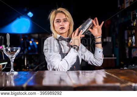 Girl Barman Makes A Cocktail At The Pothouse