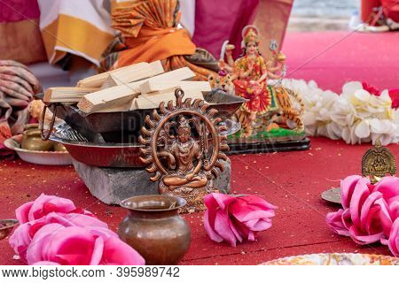 Different Traditional Accessories For Indian Wedding Ceremony On White Background With Flowers.