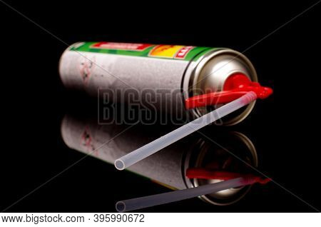 Polyurethane Foam Sprayer Adhesive Isolated On The Black Reflective Background. Product For Sealing 
