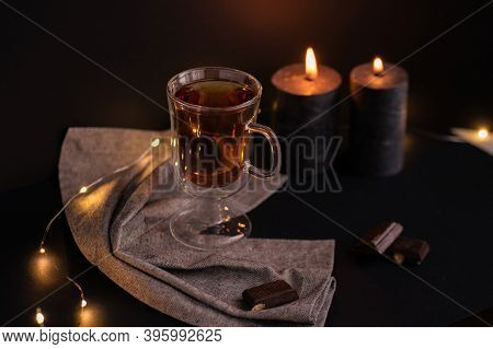 Cup Of Tea And Aromatic Candles In The Dark