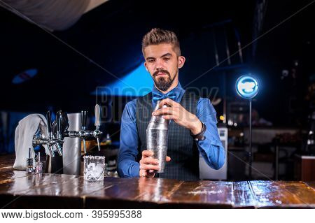 Barman Makes A Cocktail At The Taproom