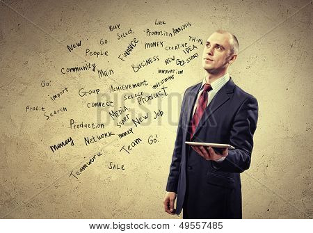 Businessman holding tablet pc