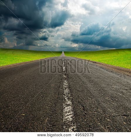 Asphault Road In Green Field Over Blue Sky