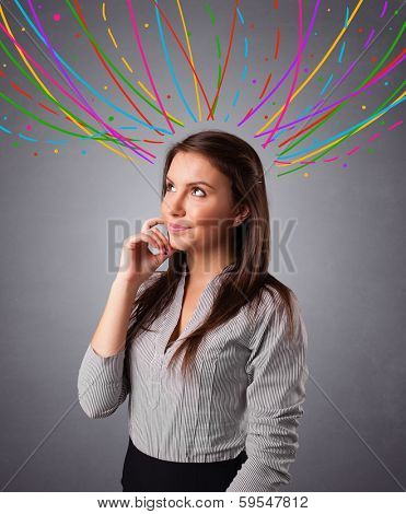Pretty young girl thinking with colorful abstract lines overhead
