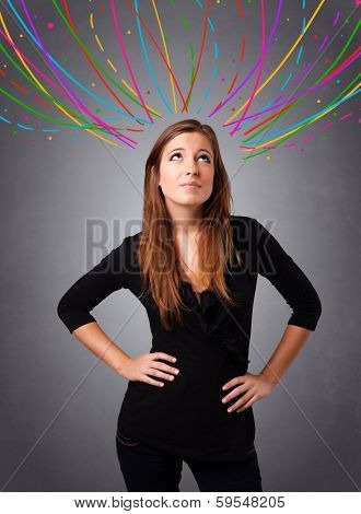 Pretty young girl thinking with colorful abstract lines overhead