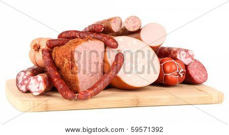 Lot of different sausages on wooden board isolated on white