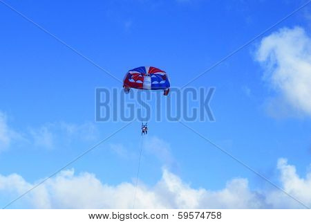 Parasailing in a blue sky in Punta Cana, Dominican Republic