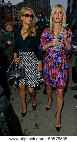 NEW YORK-FEB 9: Paris Hilton and Nicky Hilton (R) arrive at the Diane von Furstenberg fashion show during Mercedes-Benz Fashion Week at Spring Studios on February 9, 2014 in New York City.