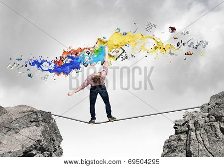 Young man in casual evading from flying icons