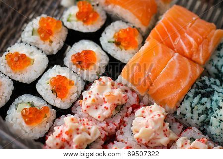 Sushi roll with salmon and caviar fish