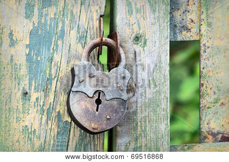 Old Lock On The Fence
