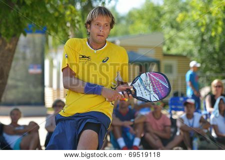MOSCOW, RUSSIA - JULY 20, 2014: Vinicius Font of Brazil in the final match against Italy during ITF Beach Tennis World Team Championship. Italy won 2-0