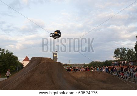 BONTIDA - JUNE 21: Unidentified BMX rider making a bike jump during the BMX Competition, at Electric Castle Festival on June 21, 2014 in the Banffy castle in Bontida, Romania