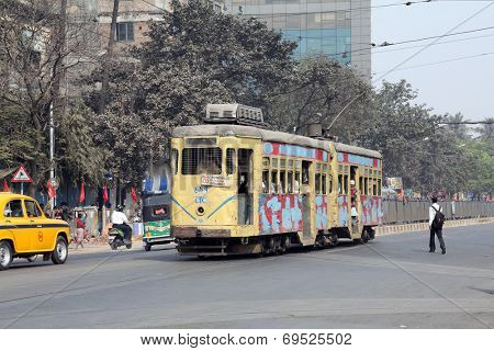 KOLKATA, INDIA - FEB 08: Traditional tram downtown Kolkata on February 08, 2014. Kolkata is the only Indian city with a tram network, which is operated by the Calcutta Tramways Comp.