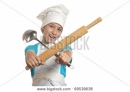 Kitchen boy holding battledore and ladle