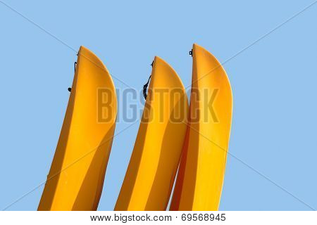 Prows Or Front Of Three Plastic Kayaks Or Canoes