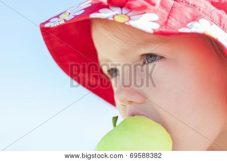child girl eating apple