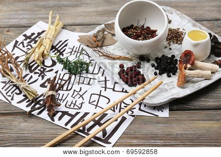 Traditional chinese herbal medicine ingredients with not real hieroglyphs, close-up