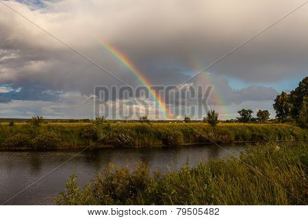 Colorful Ranibow Over The Falls And Water
