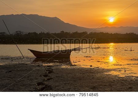 silhouette fishing boat and sunset in Thailand