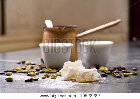 Turkish Coffee with coffee beans and Cardamom scattered on a vintage background
