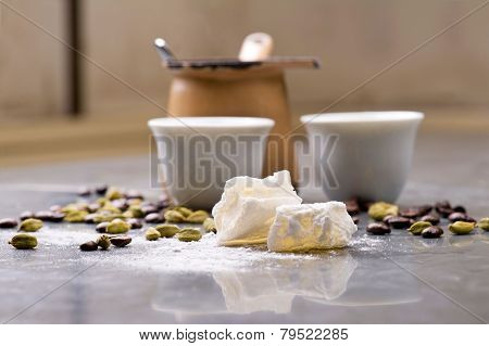 Turkish Coffee with coffee beans and Cardamom scattered on a vintage background