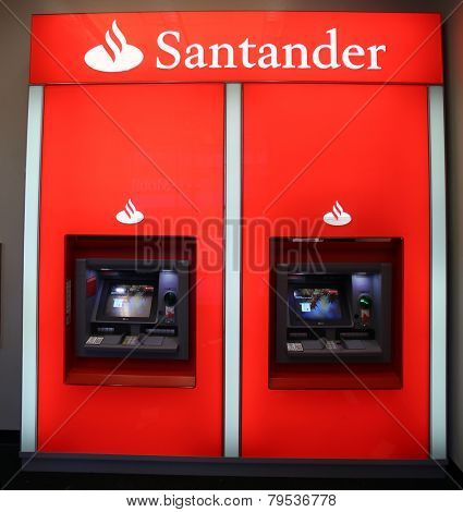 NEW YORK CITY - TUESDAY, DEC. 30, 2014: A pair of Santander Bank ATM. Santander Consumer USA Inc is wholly owned by the Spanish Santander Group.