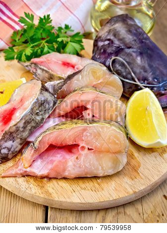 Catfish raw with lemon on board